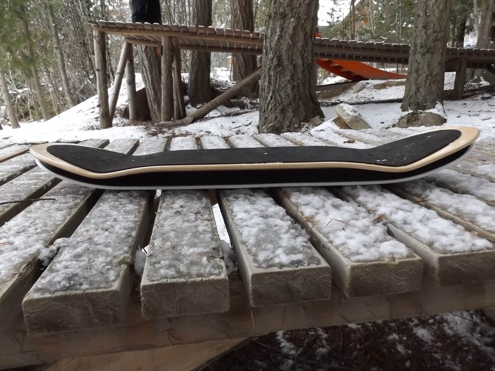 SlopeDeck resting on a snowy backyard feature